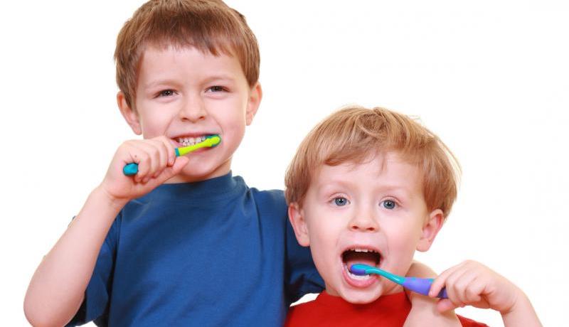 boys brushing teeth